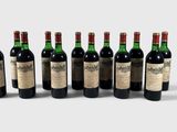 six bottles of wine are lined up in a row