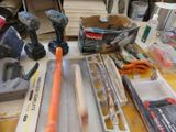 many tools that are sitting on a workbench