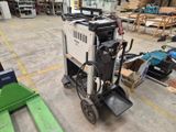 a machine that is sitting in the middle of a warehouse