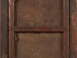 a close up of a wooden frame with a label on it