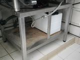 a machine that is sitting on a table in a kitchen