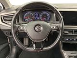 the interior of a car with a steering wheel and gauges