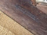 a close up of a piece of wood with a piece of wood sticking out of it