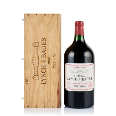 a bottle of wine sitting next to a wooden box