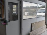 an image of a building that has a door and a window