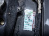 a close up of a car ' s engine with a sticker on it