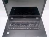 a laptop that is open on a white surface