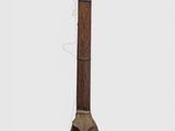an old musical instrument with a wooden body on a white surface