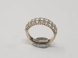 a close up of a diamond ring on a white surface