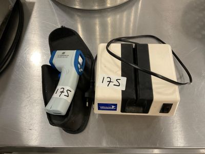 a black and white box and a blue and white hair dryer on a table