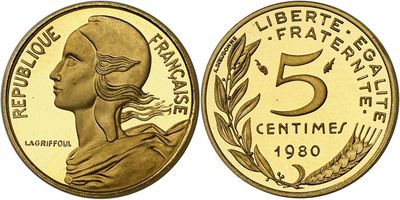 a gold coin with the face of a woman in profile