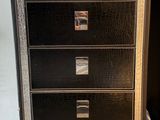 an image of a metal filing cabinet with five drawers