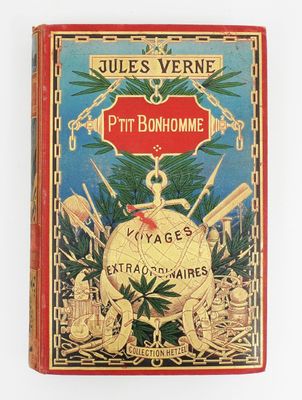 un vieux livre à la couverture rouge posé sur une table