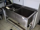 two sinks in the kitchen with a faucet and a sink