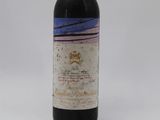 a bottle of wine that is sitting on a table