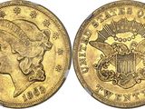 a gold coin with a woman ' s head and eagle on it