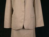 an image of a woman ' s suit and skirt on a mannequin