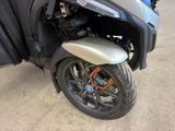 a motorcycle that is parked on the street in the parking lot