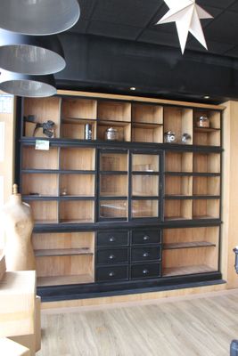 a room with a large bookcase and a star hanging from the ceiling