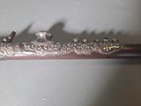 a metal pipe that has a bird on top of it