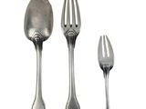 three forks and two spoons sitting next to each other
