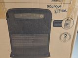 a box with a picture of a black electric heater in it