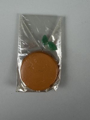 a small cookie in a plastic bag on a table