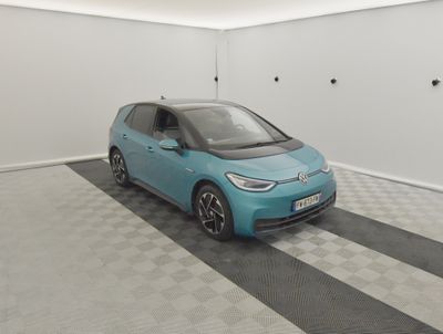 an image of a small blue car in a garage