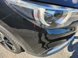 a close up of a car ' s headlight and front bumper