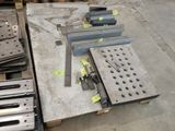 many pieces of metal on a pallet in a warehouse