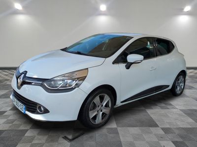 a white car is parked in a room with a checkered floor