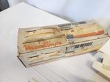 a box of cigarettes sitting on a table next to a pair of scissors