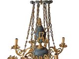 an image of a chandelier with a statue on the top of it