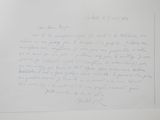 a piece of paper with a handwritten letter on it