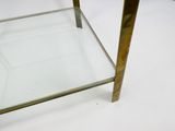 an image of a glass and brass coffee table on a white surface