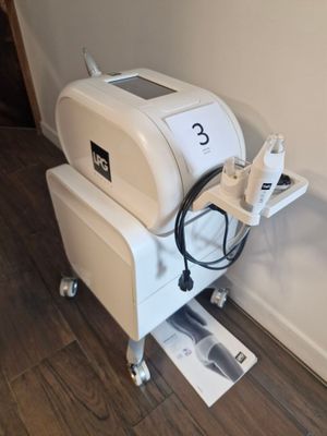 a machine that is sitting on the floor next to a wall