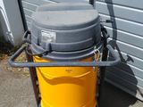 a yellow and gray machine with a hose on it