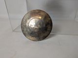 a metal ball that is sitting on a table
