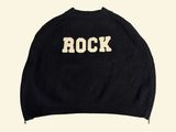 a black sweater with the word rock written on it