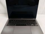 a laptop computer that is sitting on a white surface