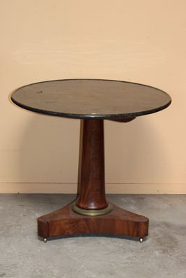 an image of a round table with a wooden base