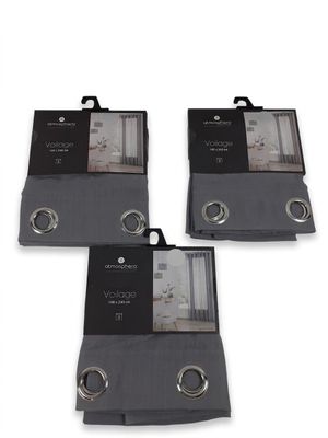 three black and white towels are on display on a white background