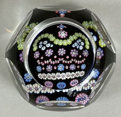 a glass bowl with a design on it sitting on a table
