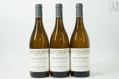three bottles of wine sitting on top of a white table