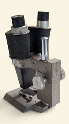 a close up of a microscope with two lenses on it