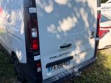 a white van that is parked in the grass