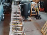 a ladder that is sitting in a garage next to a car
