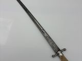an old knife with a wooden handle on a white surface