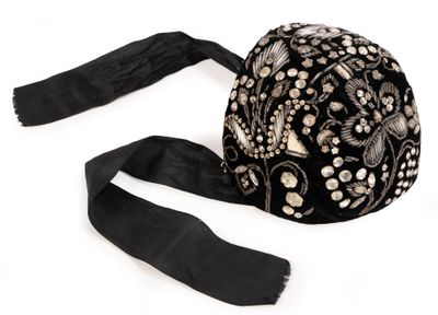 an image of a black hat with flowers and pearls on it