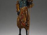 an image of a statue of a woman with a basket on her head